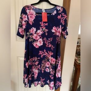 New with tags. Navy blue dress w pink flowers.